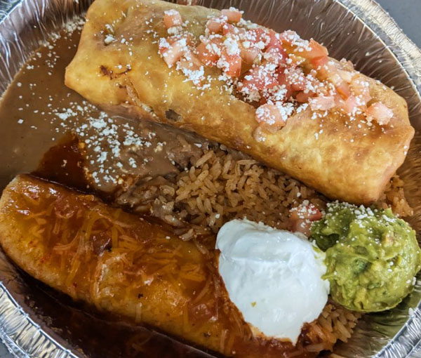 Golden chimichanga with Mexican rice, sour cream, and guacamole