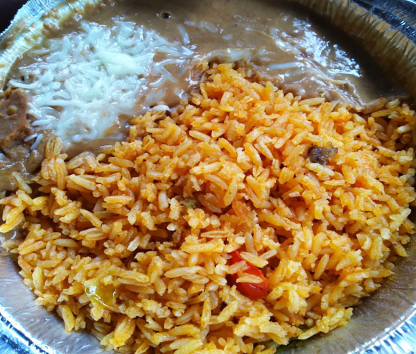 Flavorful Mexican rice with refried beans