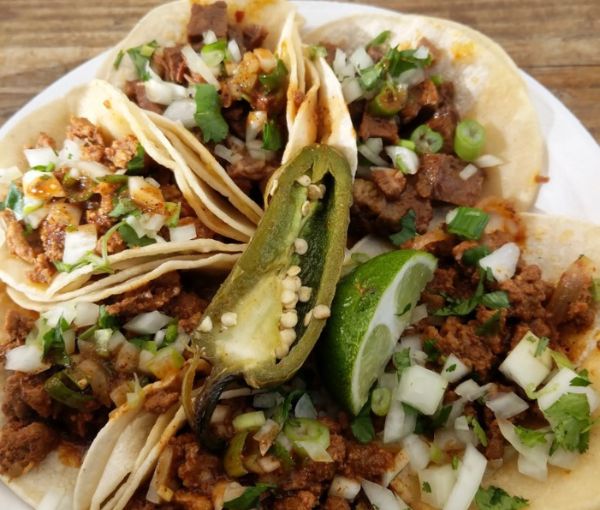 Assorted street tacos with various meats and toppings