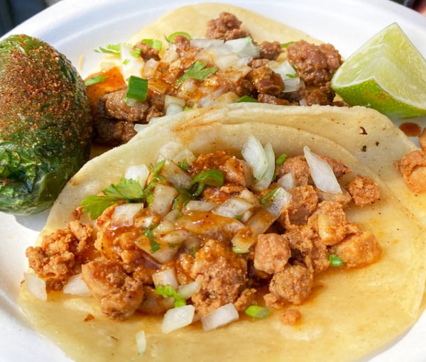 Street tacos with chorizo, onions, cilantro, and grilled jalapeño